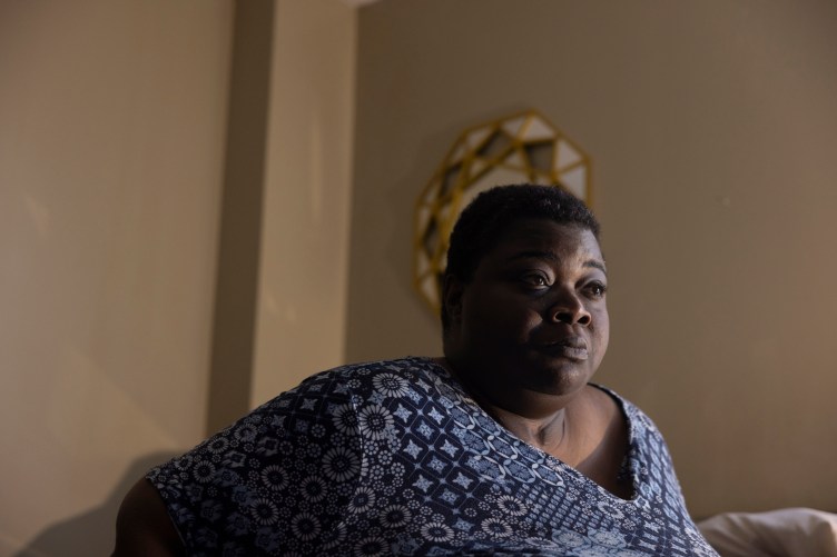A close-up photo of a woman looking off camera. 