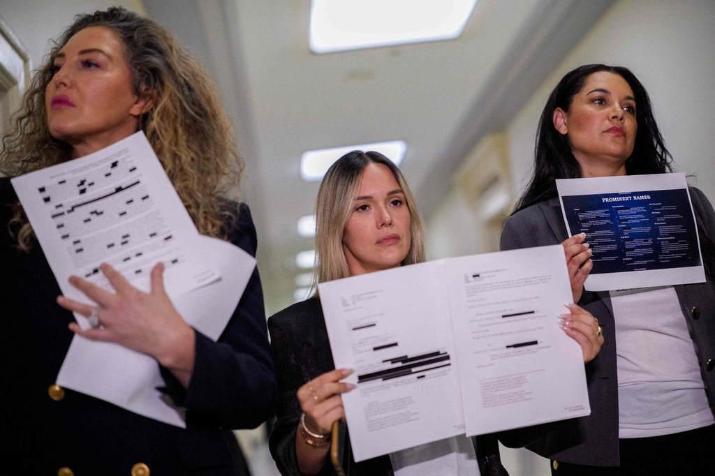 Epstein survivors (from left) Lara Blume McGee, Andrea Sterling and Sharlene Rochard hold up redacted documents related to the investigation outside a House Oversight Committee closed-door interview with former US Attorney General Pam Bondi on Friday. Photo: AFP Epstein survivors (from left) Lara Blume McGee, Andrea Sterling and Sharlene Rochard hold up redacted documents related to the investigation outside a House Oversight Committee closed-door interview with former US Attorney General Pam Bondi on Friday. Photo: AFP