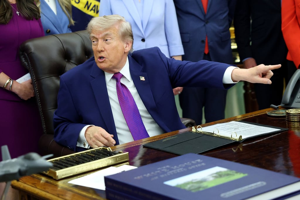 US President Donald Trump points out a member of the press during an event in the Oval Office on May 11. Photo: Getty Images/TNS US President Donald Trump points out a member of the press during an event in the Oval Office on May 11. Photo: Getty Images/TNS