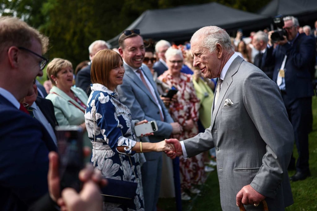 Britain’s King Charles (right) attends a garden party at Hillsborough Castle in Northern Ireland on Wednesday. Photo: AFP Britain’s King Charles (right) attends a garden party at Hillsborough Castle in Northern Ireland on Wednesday. Photo: AFP