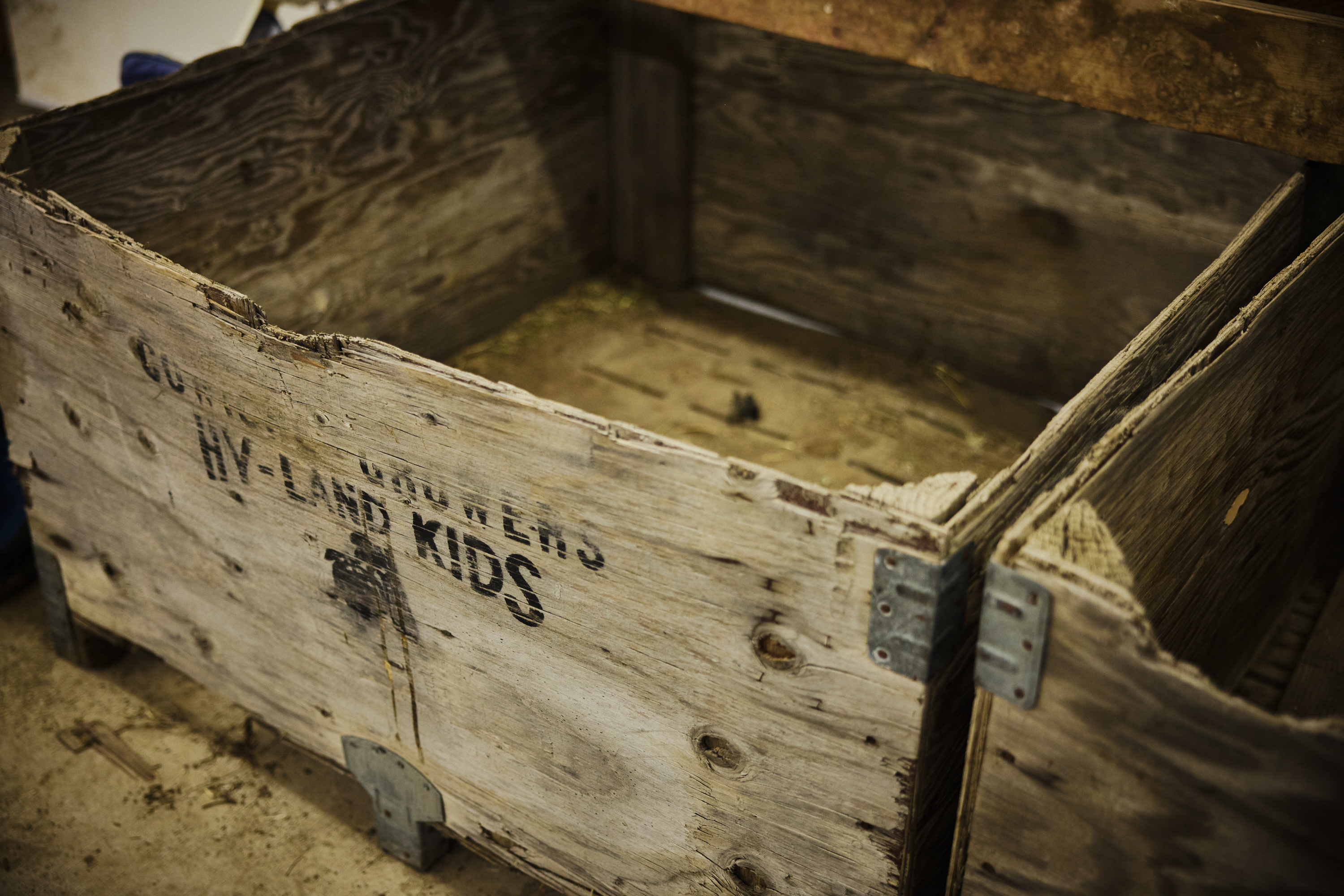 Empty bins made of weathered and battered wood. 
