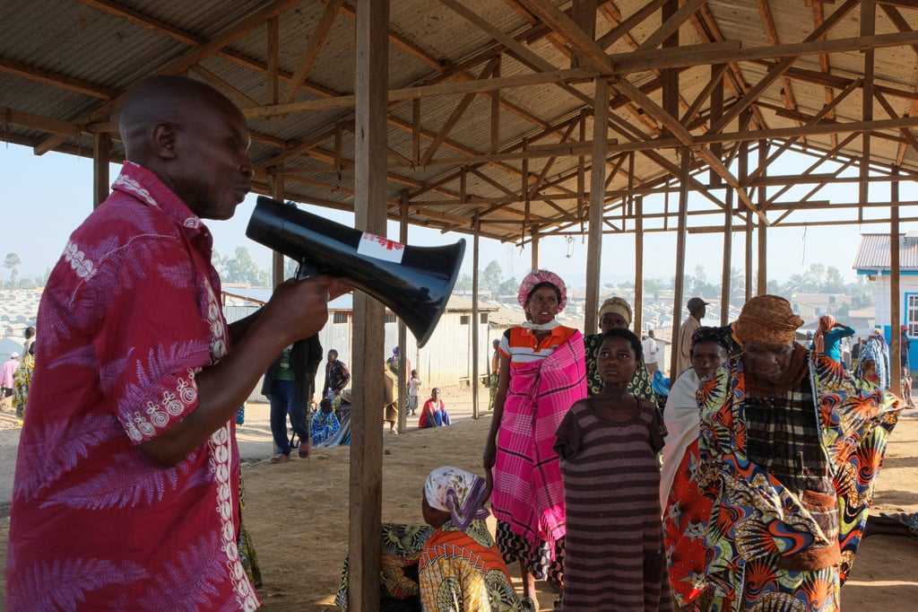 Dz’djo Ndrutsi Etienne (left), president of the Kigonze camp, speaks during an Ebola awareness session on Friday. Photo: Reuters Dz’djo Ndrutsi Etienne (left), president of the Kigonze camp, speaks during an Ebola awareness session on Friday. Photo: Reuters
