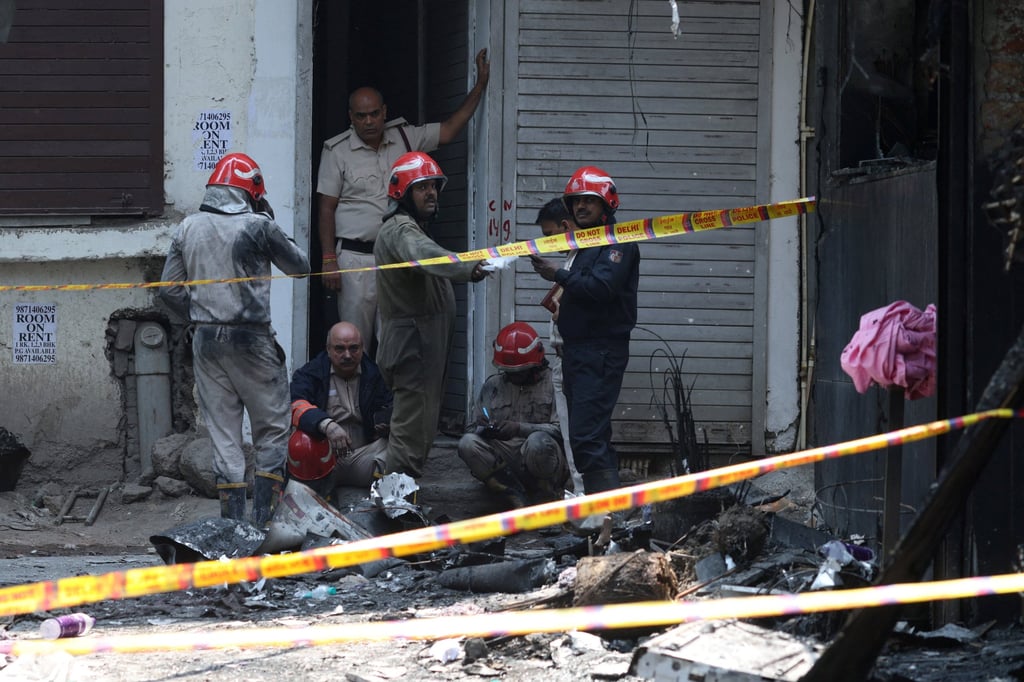 Firefighters work at the site of a fire, which broke out in the morning at Flourish Stay, a bed-and-breakfast in a congested neighbourhood in the south of the New Delhi on Wednesday. Photo: Reuters Firefighters work at the site of a fire, which broke out in the morning at Flourish Stay, a bed-and-breakfast in a congested neighbourhood in the south of the New Delhi on Wednesday. Photo: Reuters