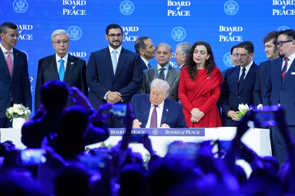 US President Donald Trump signs the charter of his Board of Peace initiative at the World Economic Forum in Davos, Switzerland in January. Photo: AP US President Donald Trump signs the charter of his Board of Peace initiative at the World Economic Forum in Davos, Switzerland in January. Photo: AP