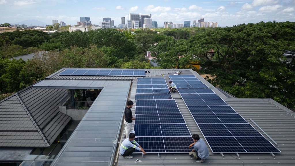 A team of installers set up a new rooftop solar system at a home in Manila on May 1. Between March and May, the Philippines imported US$407 million worth of solar panels from China. Photo: AP A team of installers set up a new rooftop solar system at a home in Manila on May 1. Between March and May, the Philippines imported US$407 million worth of solar panels from China. Photo: AP