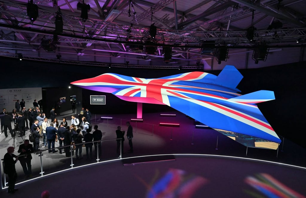 People view the Global Combat Air Programme’s 6th generation fighter jet concept design, bathed in the colours of the UK’s national flag, on the opening day of the Farnborough International Airshow, southwest of London, in 2024. Photo: AFP People view the Global Combat Air Programme’s 6th generation fighter jet concept design, bathed in the colours of the UK’s national flag, on the opening day of the Farnborough International Airshow, southwest of London, in 2024. Photo: AFP