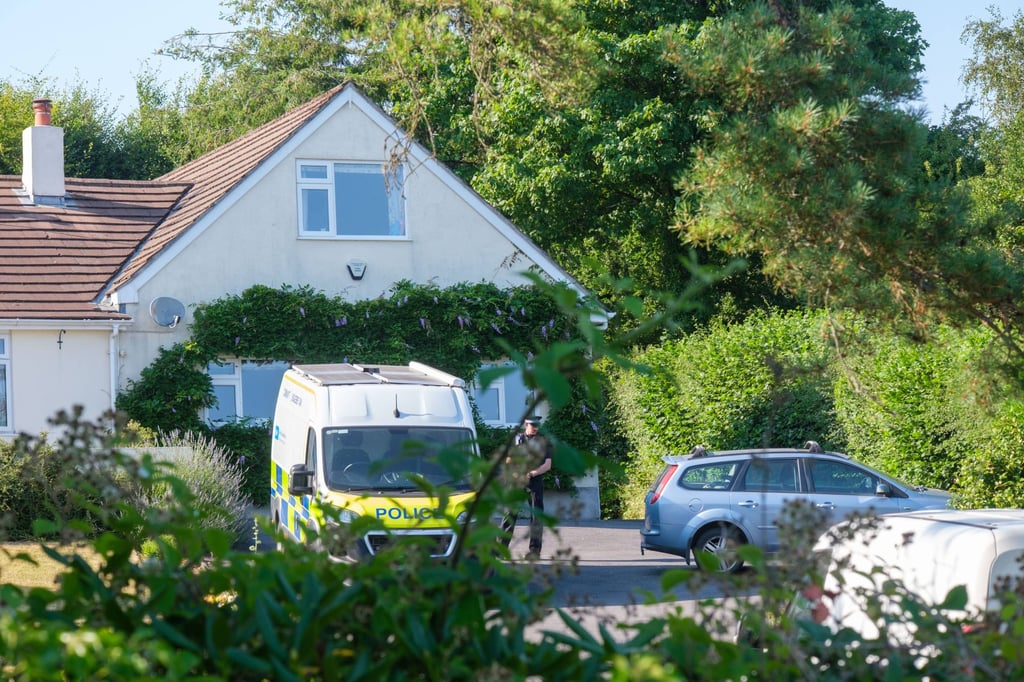 Police officers stand outside Ann Widdecombe’s home in Haytor on Friday. Photo: PA Wire via dpa Police officers stand outside Ann Widdecombe’s home in Haytor on Friday. Photo: PA Wire via dpa