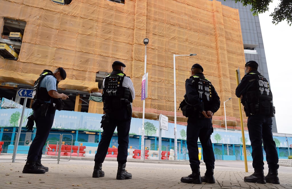 Police officers guard outside the Legislative Council building. Photo: May Tse Police officers guard outside the Legislative Council building. Photo: May Tse