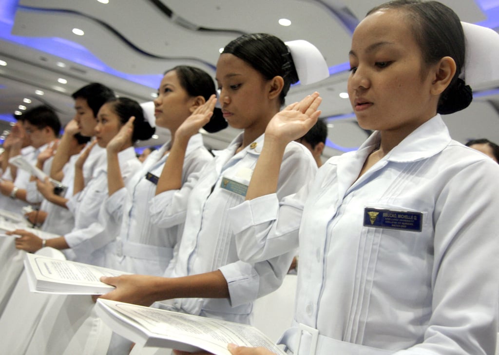 Filipino nurses, many of whom were bound for work abroad as carers, take an oath in Manila in 2009. Filipino carers have become an expensive “gold standard”, according to a recent white paper. Photo: AFP Filipino nurses, many of whom were bound for work abroad as carers, take an oath in Manila in 2009. Filipino carers have become an expensive “gold standard”, according to a recent white paper. Photo: AFP