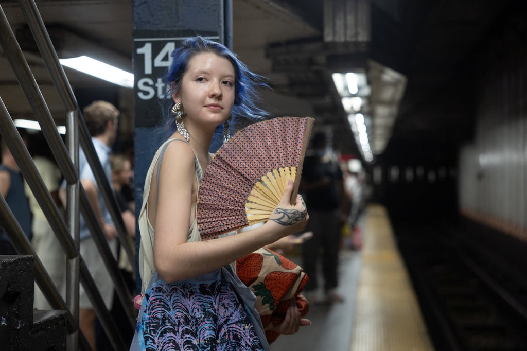 A woman fans herself at a subway station in New York City last month. Photo: Reuters A woman fans herself at a subway station in New York City last month. Photo: Reuters