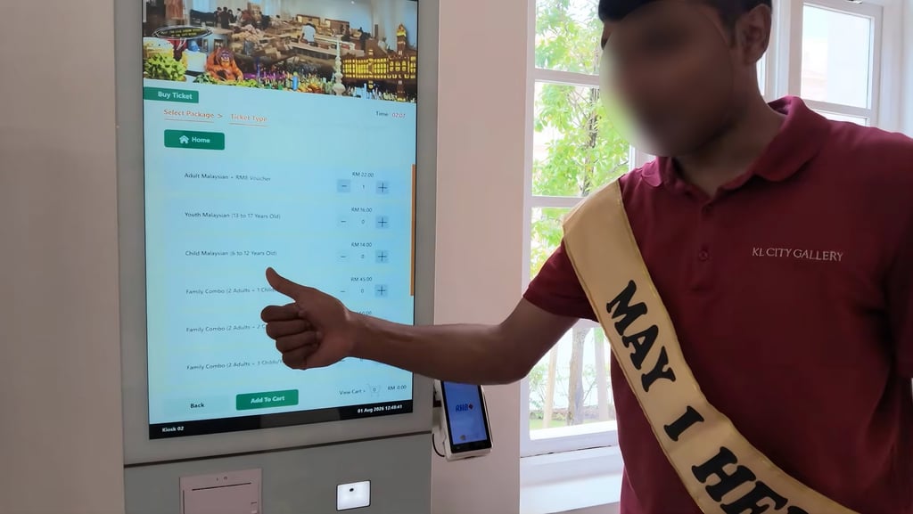 A still from a social media video shows a member of staff helping tourists at the KL City Gallery in the Sultan Abdul Samad Building, Kuala Lumpur, Malaysia. Photo: YouTube A still from a social media video shows a member of staff helping tourists at the KL City Gallery in the Sultan Abdul Samad Building, Kuala Lumpur, Malaysia. Photo: YouTube