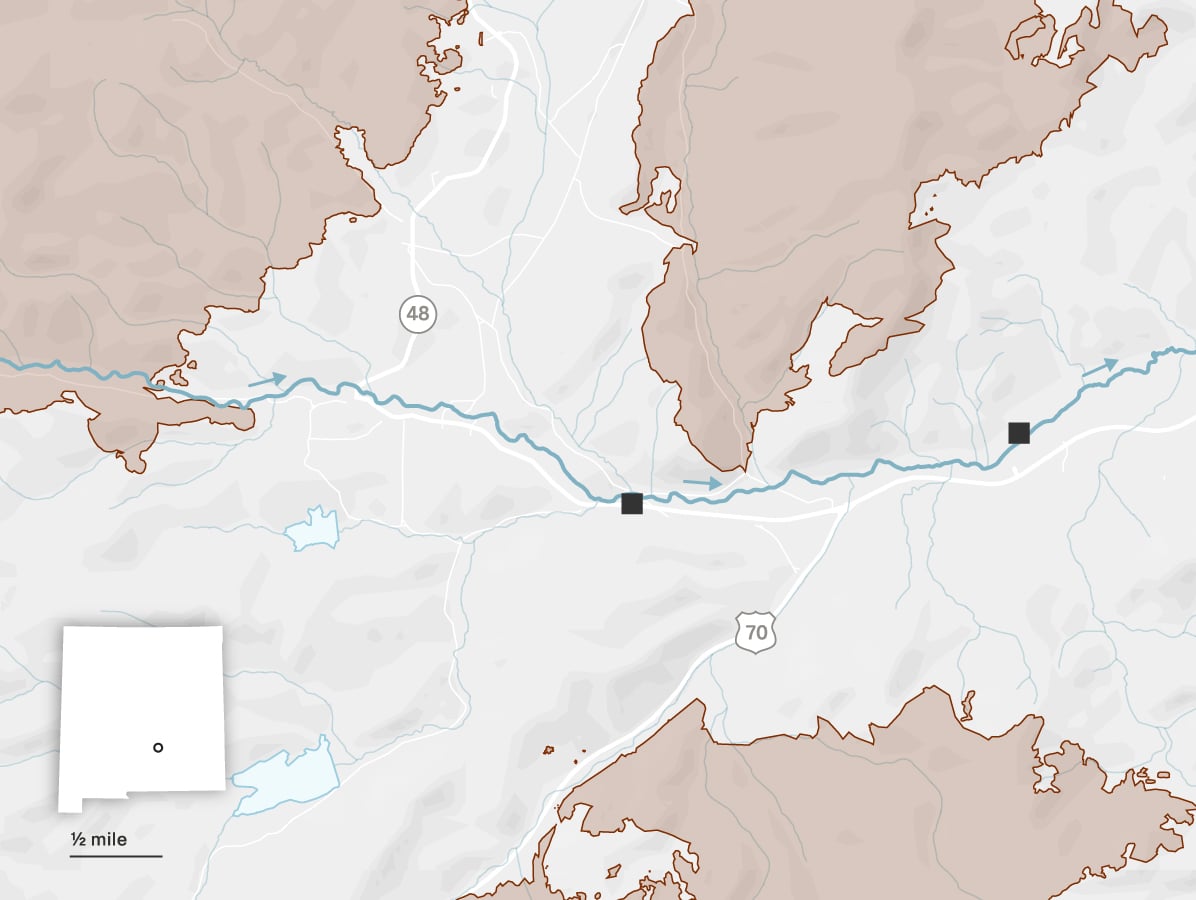 A map shows the towns of Ruidoso and Ruidoso Downs. The Rio Ruidoso runs from west to east through both towns. Two locations are identified along the river: the Riverview RV Park and a racetrack. The towns are surrounded by three large burn scars: the Salt Fire to the south, the South Fork Fire to the west and the McBride Fire to the north. 